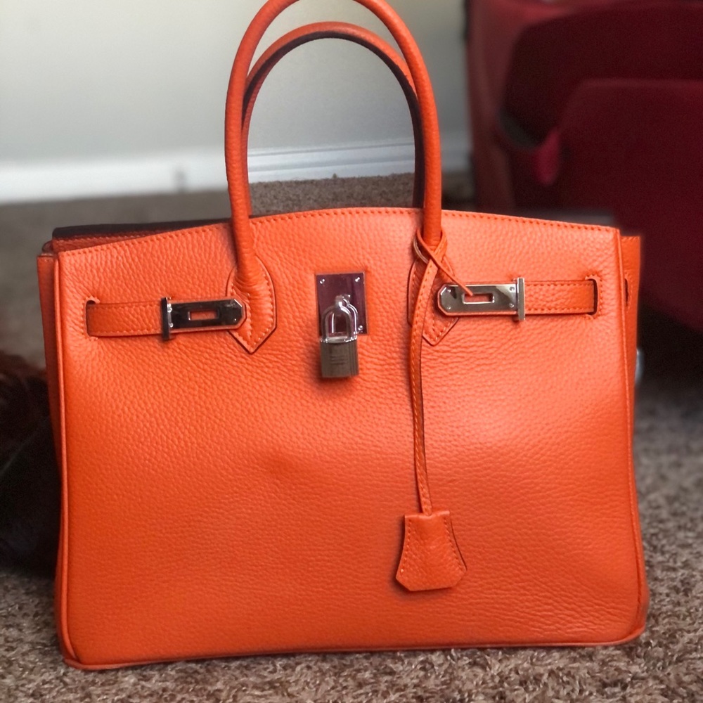 Orange hand bag with matching purse